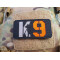 JTG K9 LaserCut Patch, schwarz, Cordura, reflektierendes Logo und Schriftzug, mit Klettrückseite